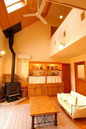 Living room with built in bookshelf by carpenters. The floor is made of solid pine.